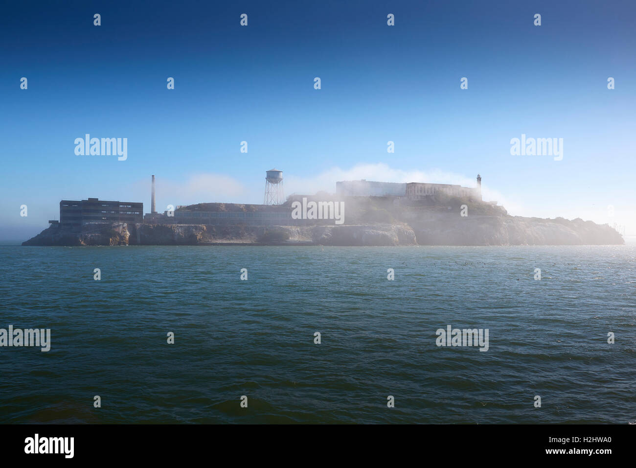 Early Morning Image Of Alcatraz, Sea Fog Rolling Over The Island. Stock Photo
