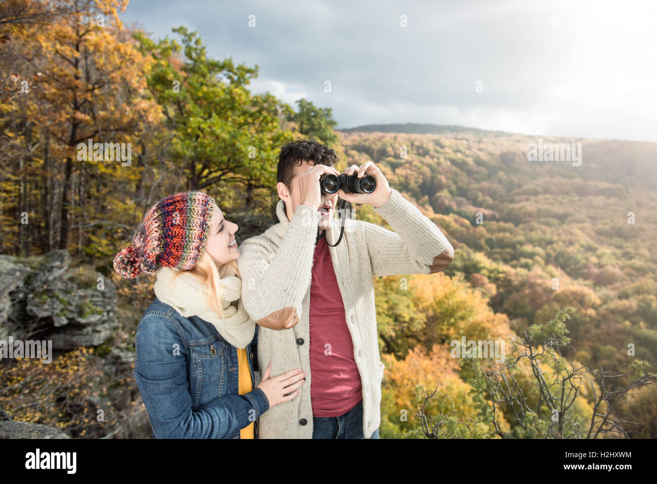 Young couple on a walk in sunny autumn forest Stock Photo - Alamy