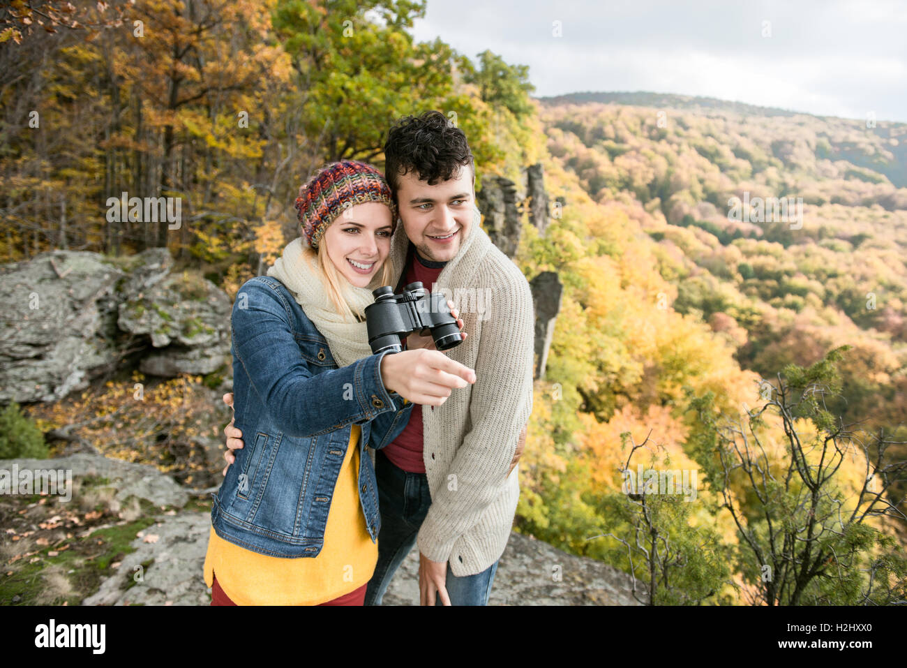 Young couple on a walk in sunny autumn forest Stock Photo - Alamy