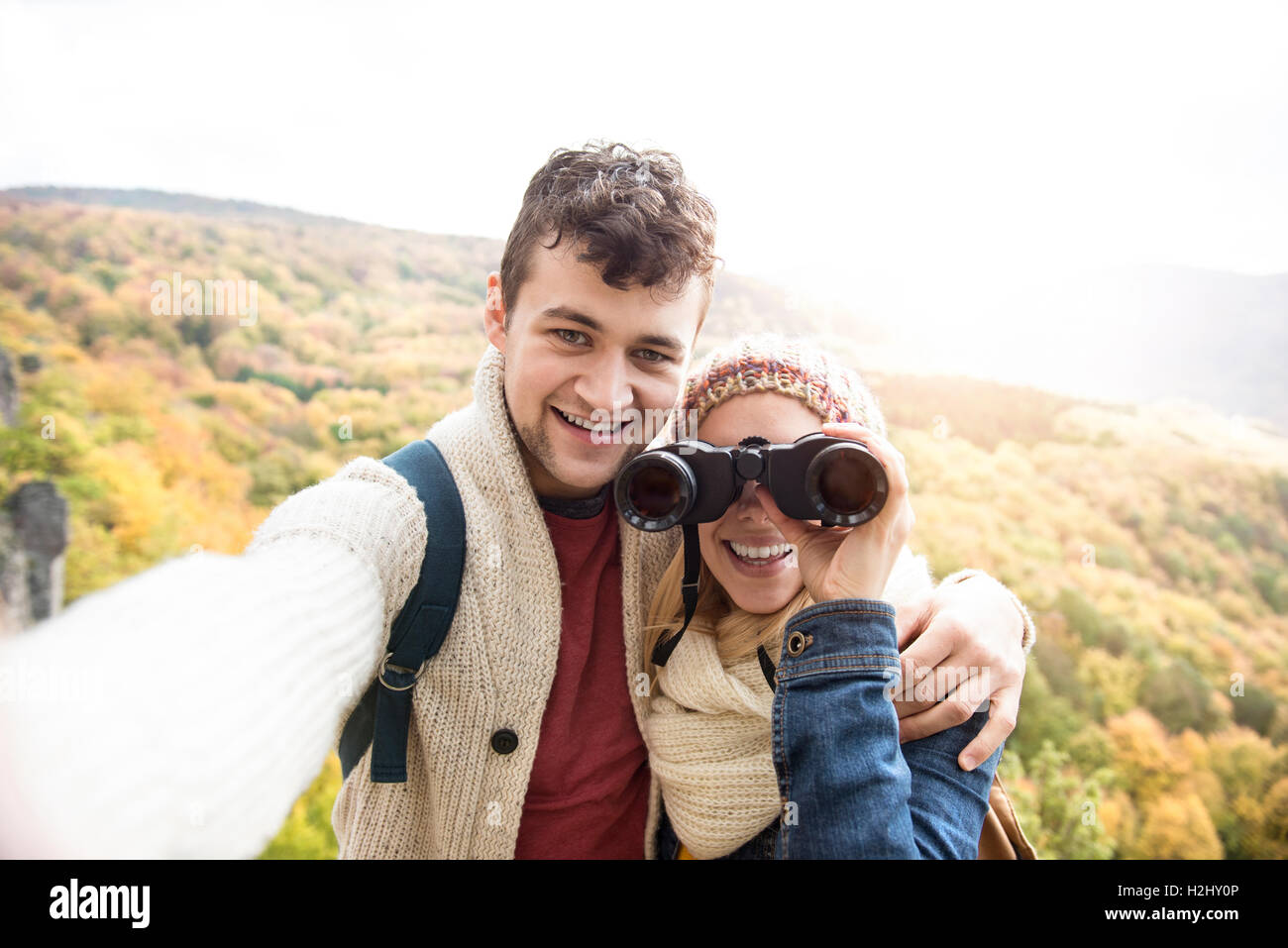 Young couple on a walk in autumn forest taking selfie Stock Photo - Alamy