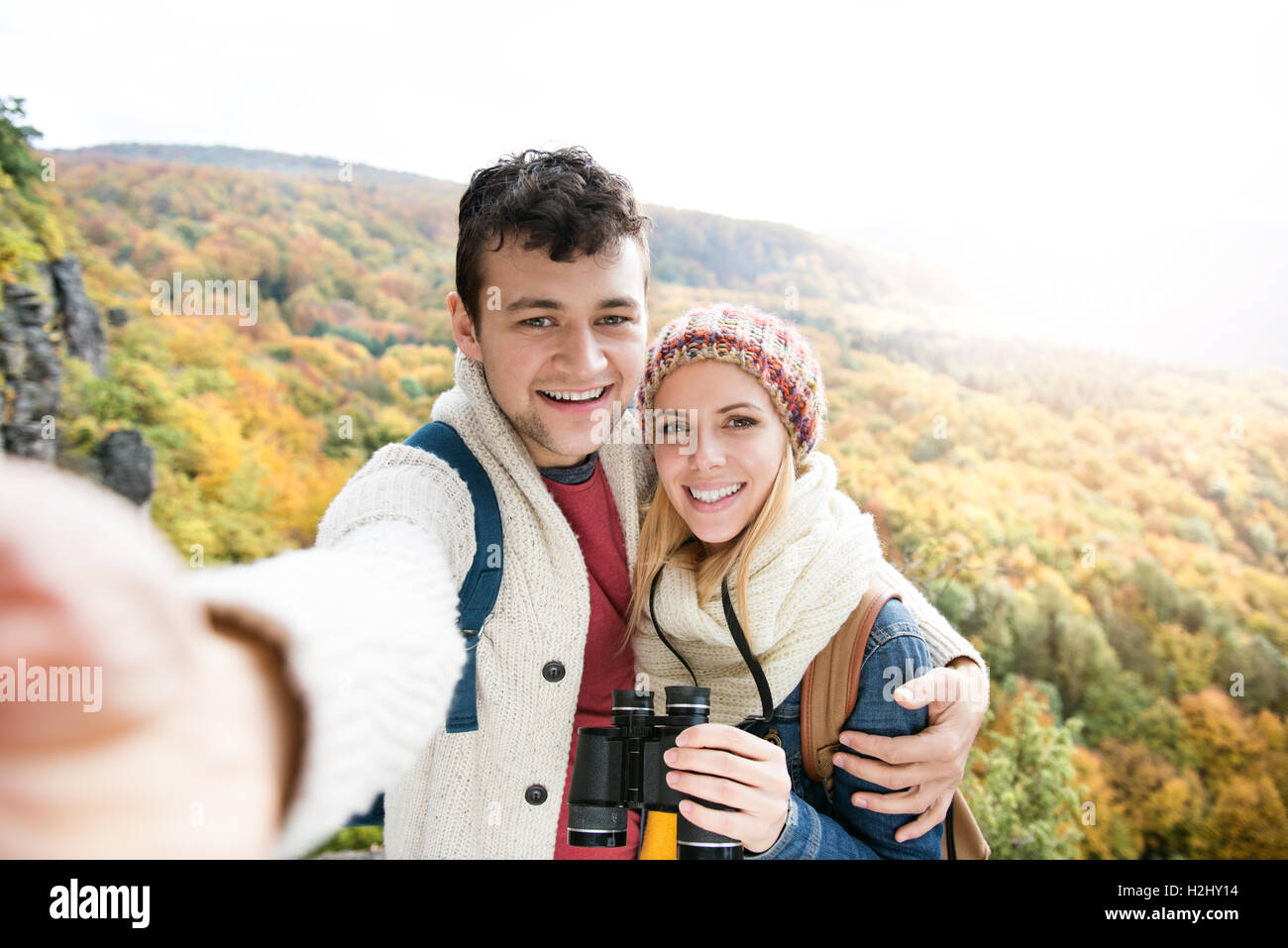 Young couple on a walk in autumn forest taking selfie Stock Photo - Alamy