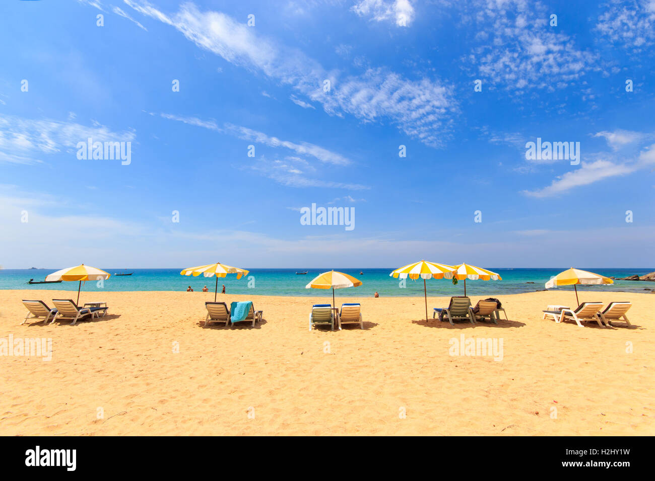 Sunbeds and umbrella on a tropical beach Stock Photo Alamy