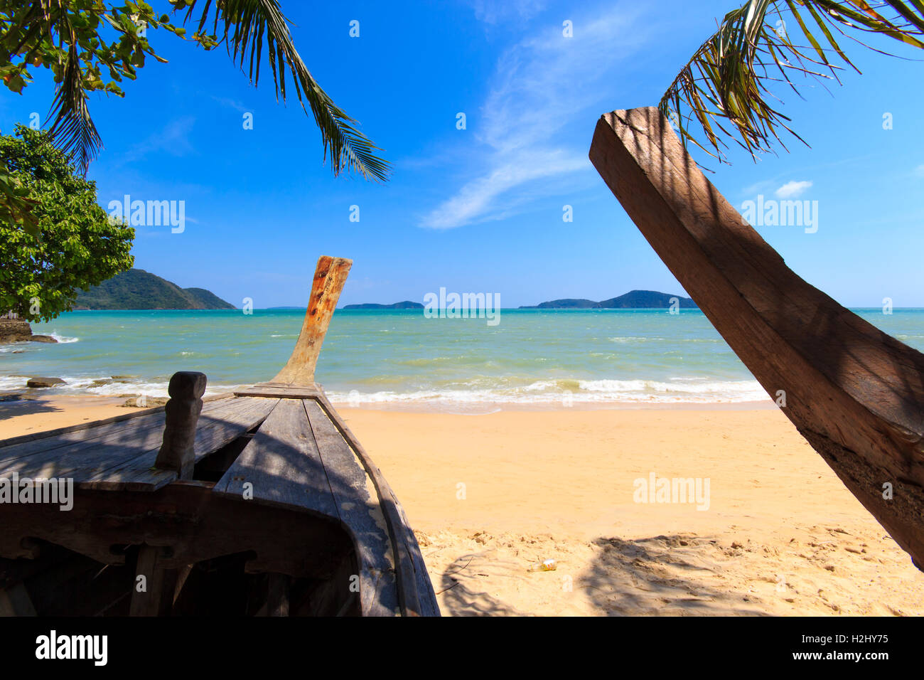 wood boat on the beach at Holidays sunny tranquil paradise beach Stock ...