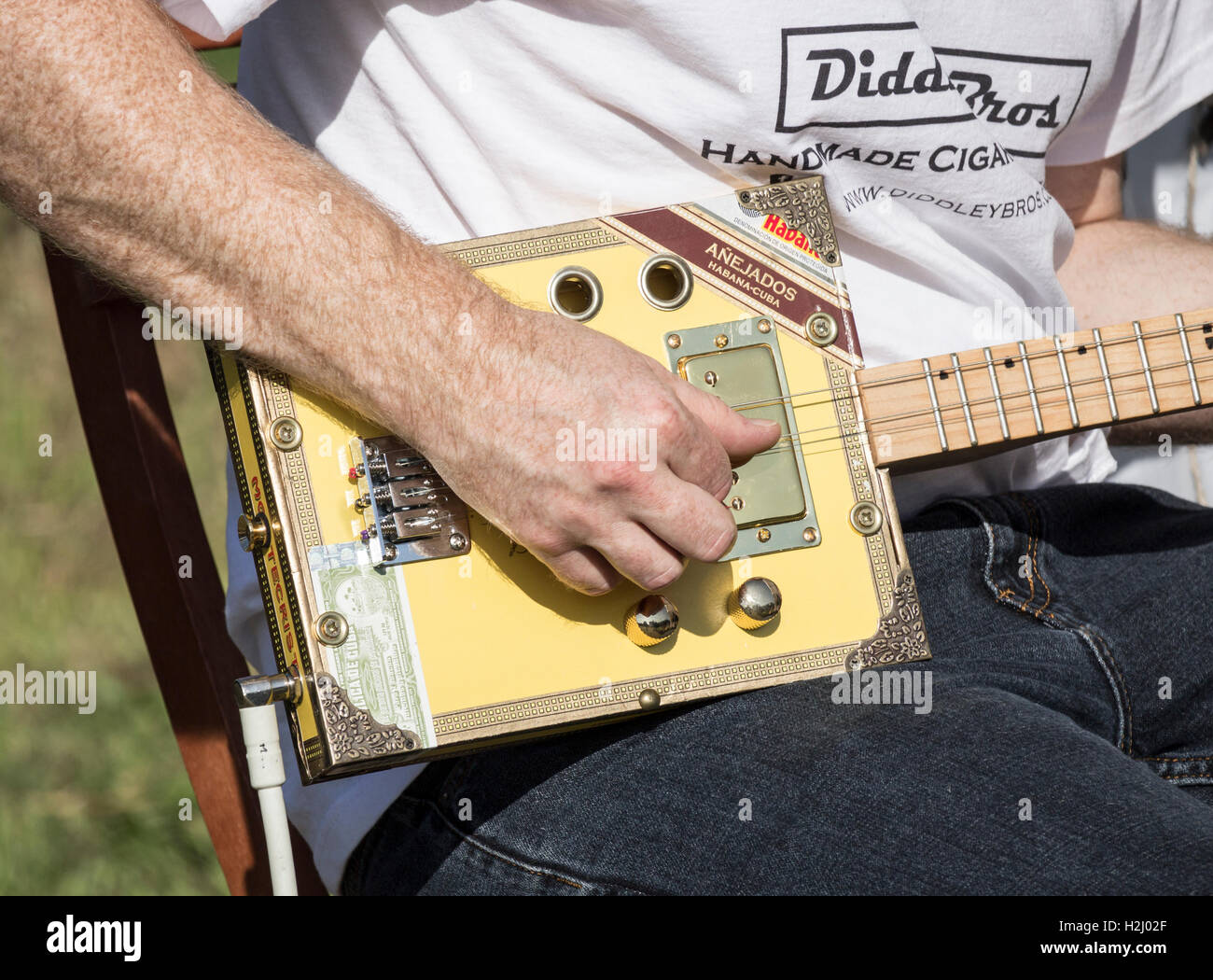 Stall selling electric guitars made from cigar boxes at Festival of