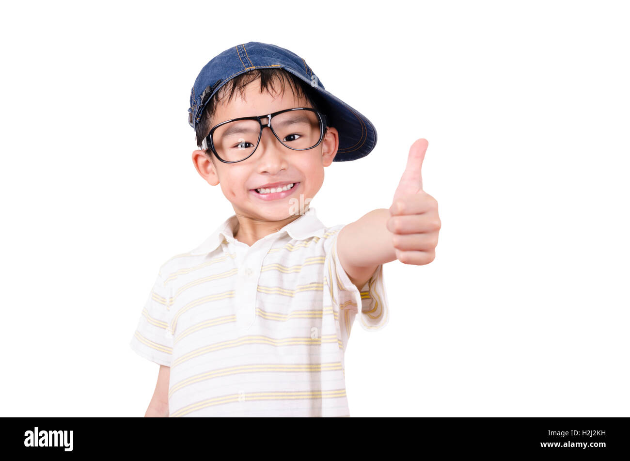 Joyful little boy holding his thumb up Stock Photo - Alamy