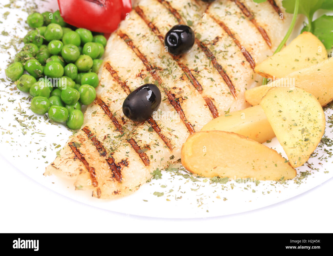 Grilled fish with popatoes. Stock Photo