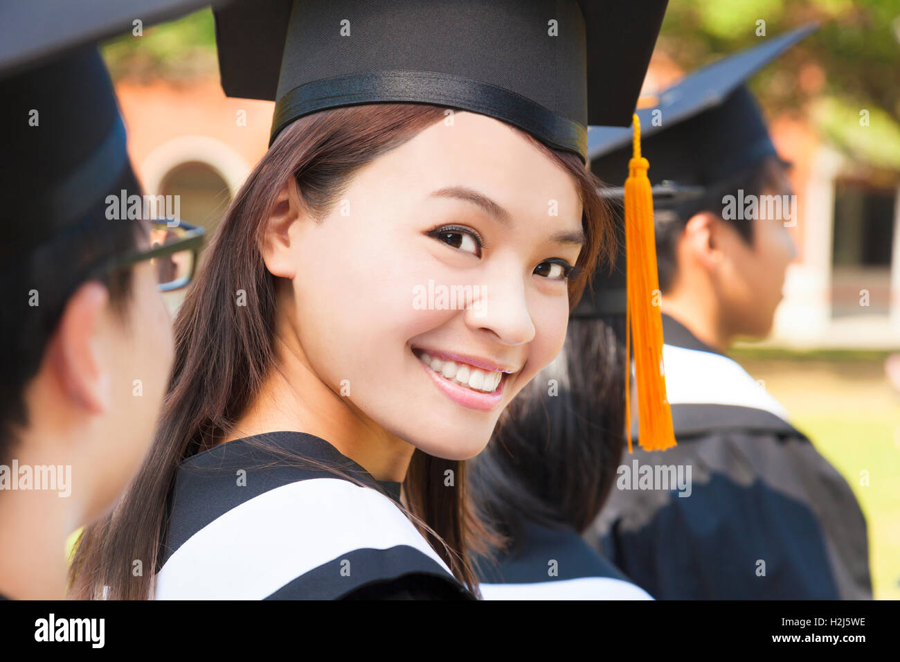 Smiling graduate woman cloud hi-res stock photography and images - Alamy