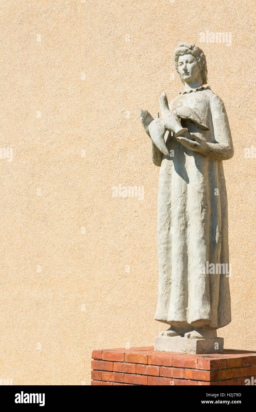 Symbol of peace: woman with dove, Lisbon, Portugal Stock Photo