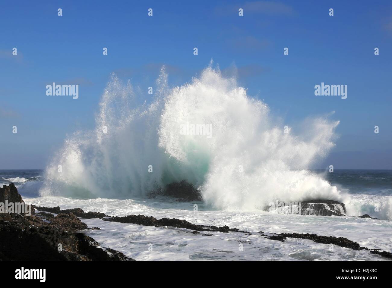 Big Wave and Rocks Stock Photo - Alamy