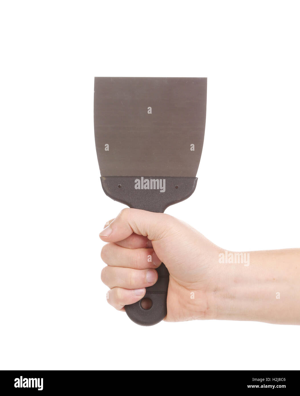 Hand holds metal spatula Stock Photo Alamy