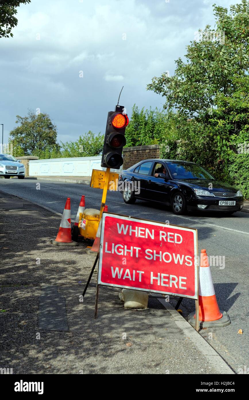 Temporary traffic lights on British roadside Stock Photo