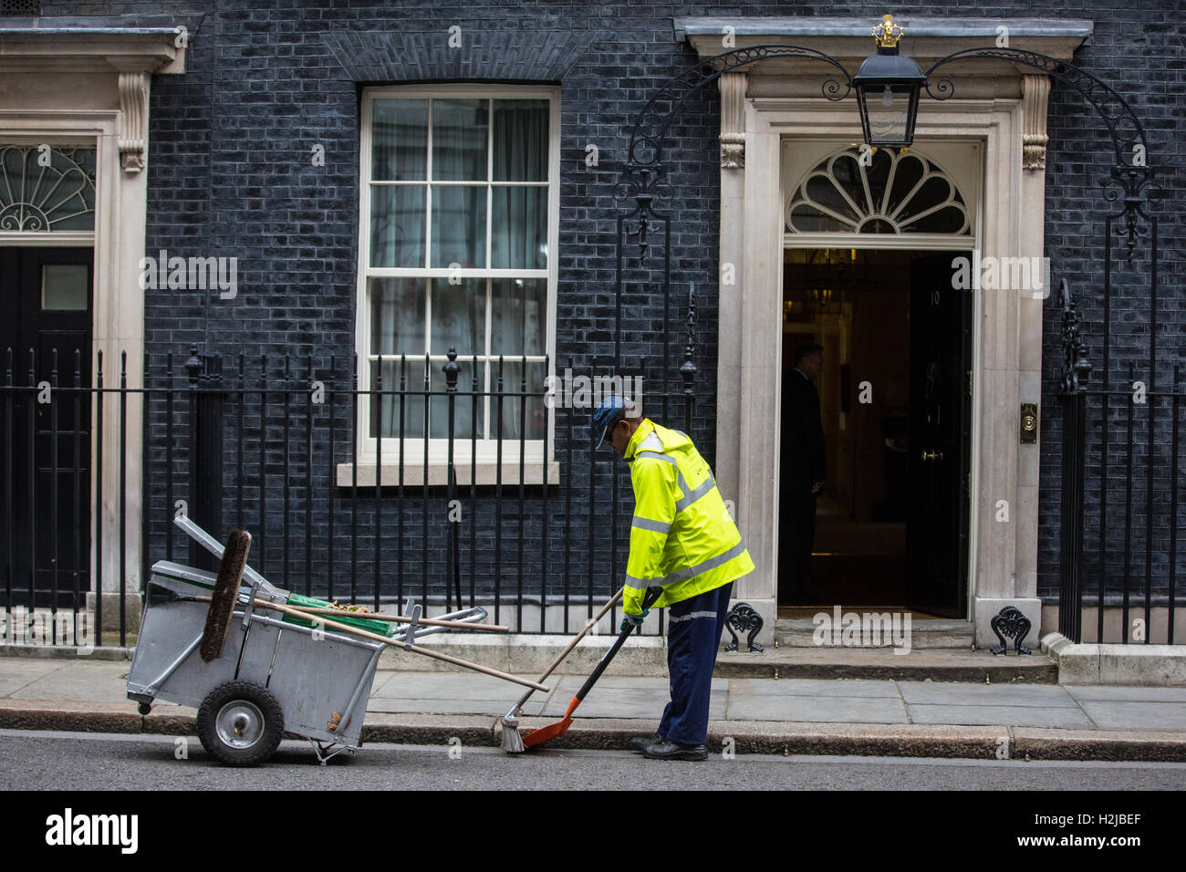 London, UK. 27th September, 2016. A street sweeper at work outside 10