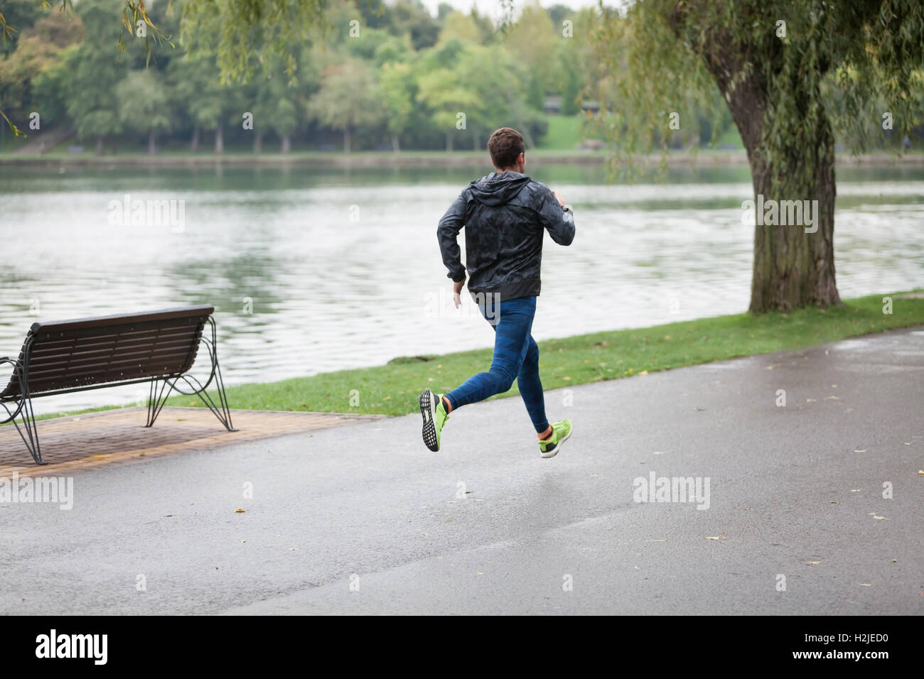 Man Running In Rain High Resolution Stock Photography and Images - Alamy