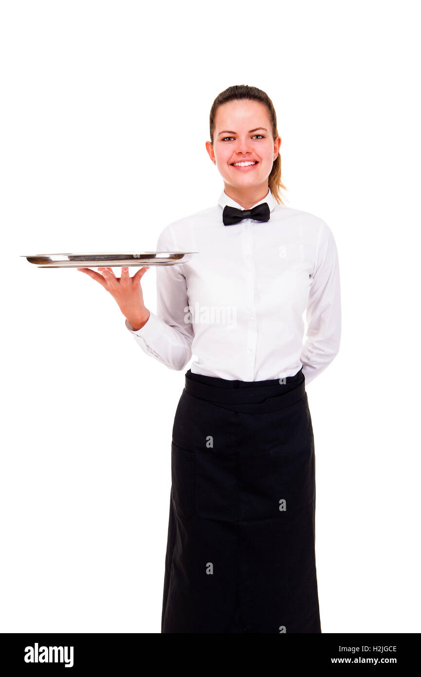 Young woman in waiter uniform holding tray isolated over white background. Stock Photo