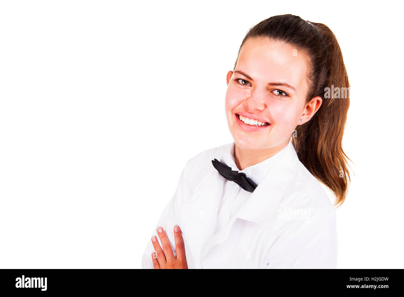 Scince woman in lab coat and bow tai smiling over white background ...