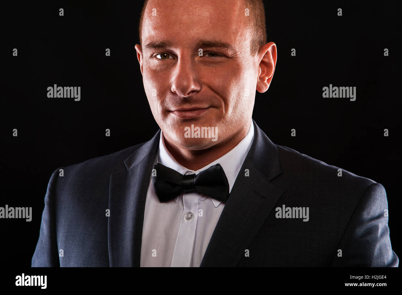 Portrait of handsome stylish man in elegant black suit Stock Photo - Alamy