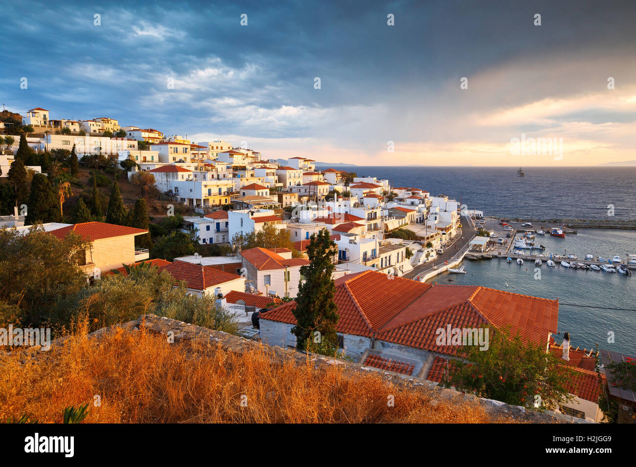 Batsi village on the coast of Andros island in Greece Stock Photo - Alamy