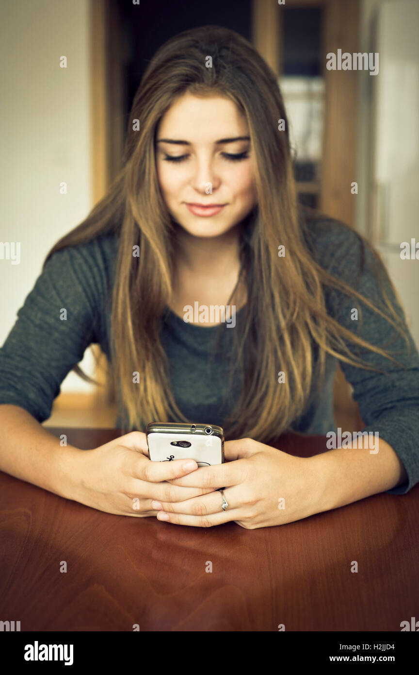 brunette tween girl texting Stock Photo