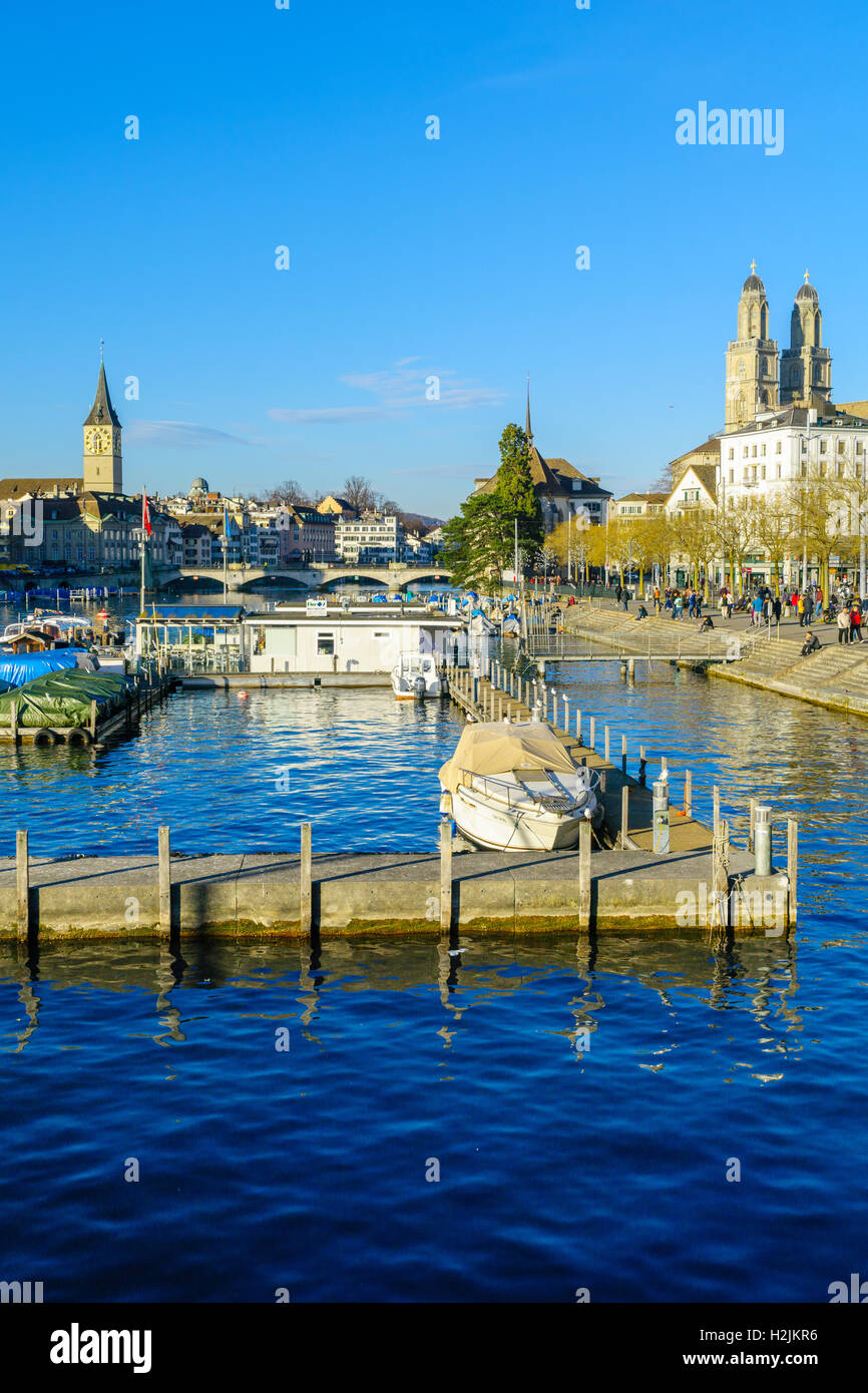 ZURICH, SWITZERLAND - DECEMBER 24, 2015: View of the Old Town (Altstadt) and the Limmat River, with the towers of Grossmunster a Stock Photo