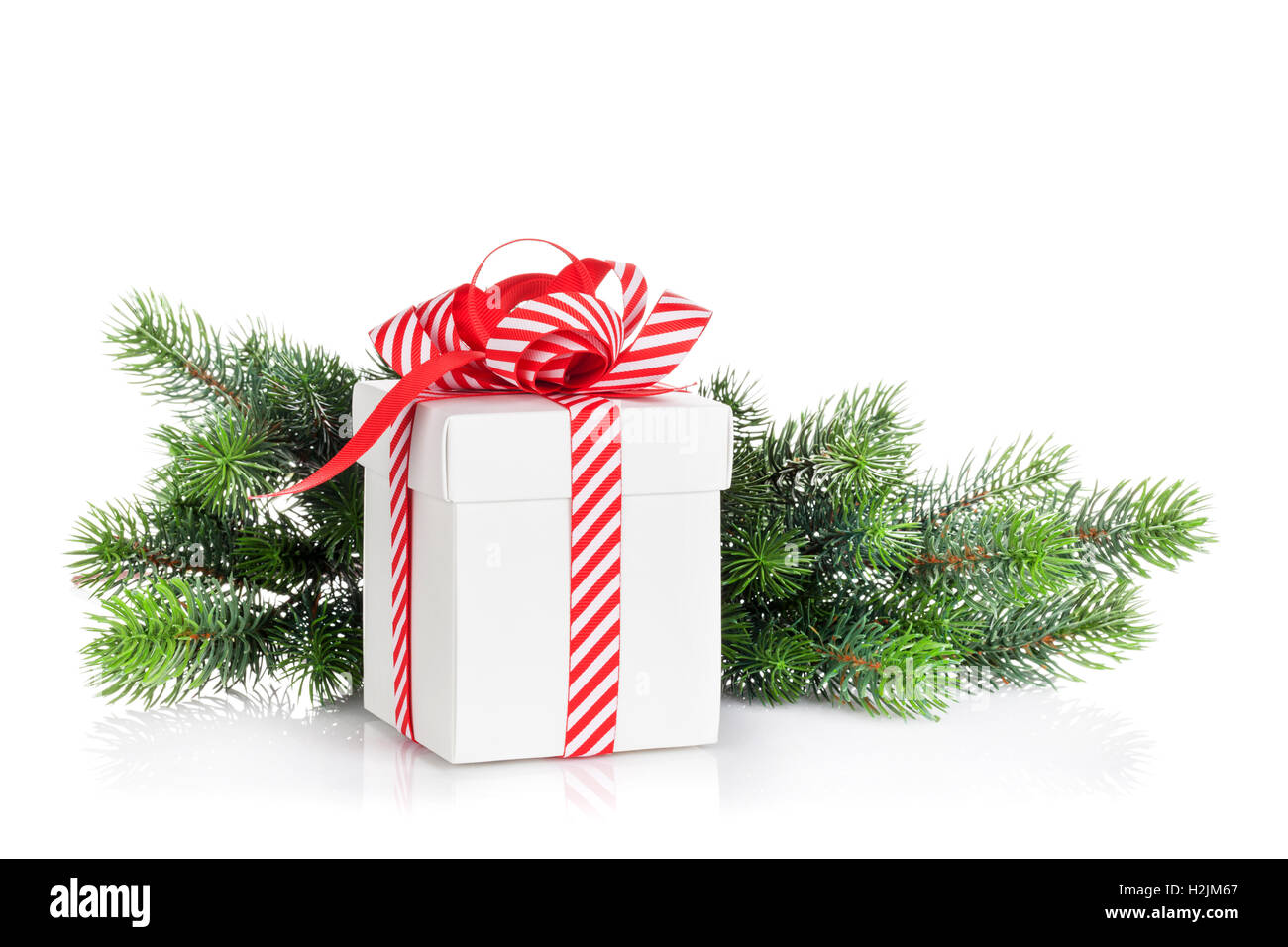 Christmas gift box and fir tree branch. Isolated on white background ...