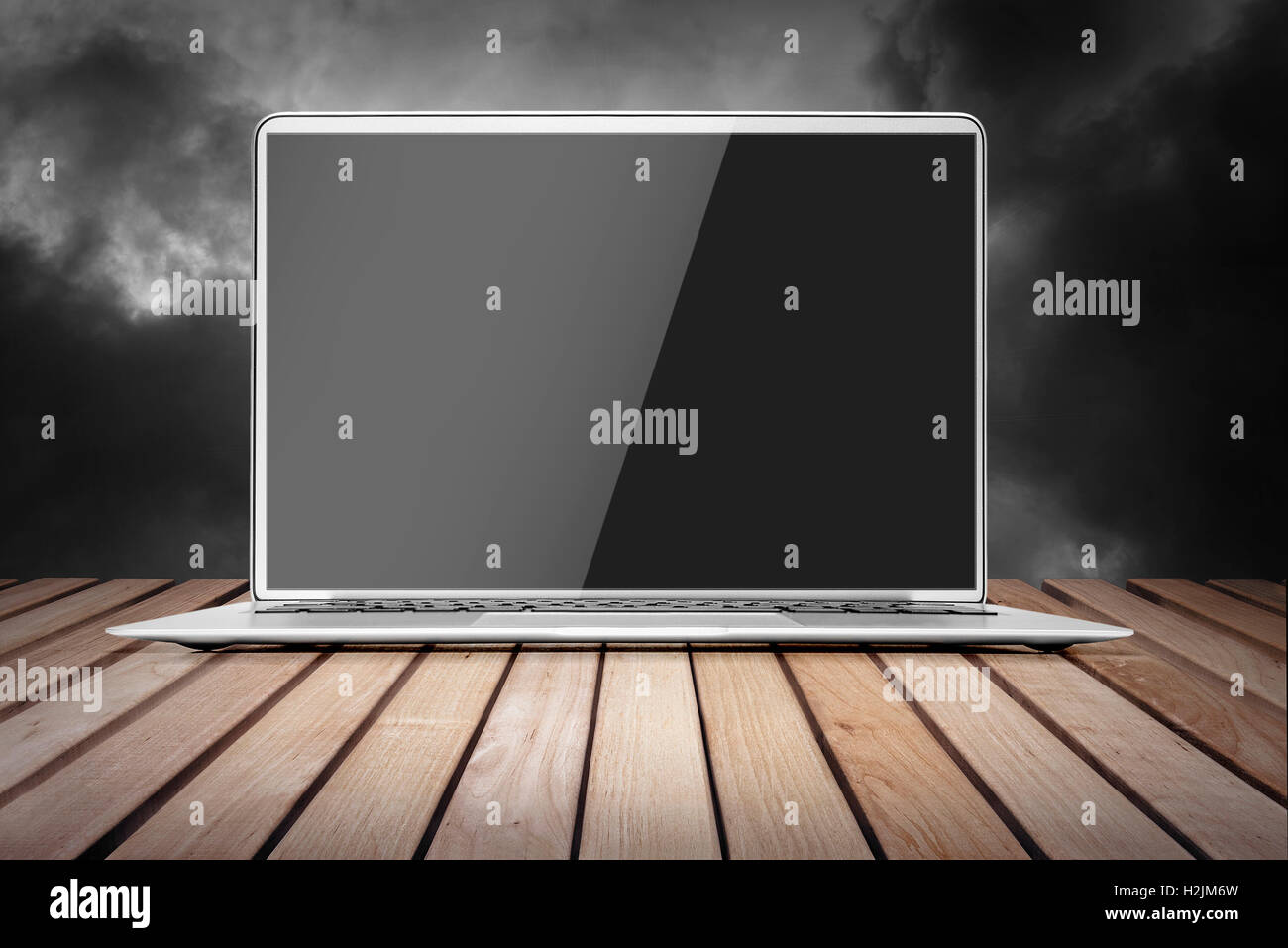 Wood platform and a laptop with a empty screen Stock Photo - Alamy