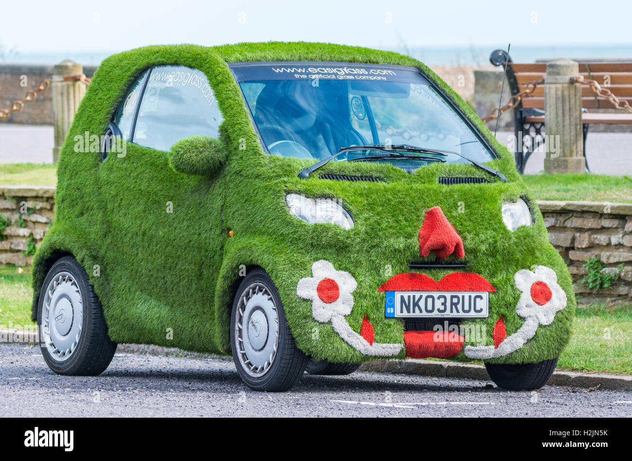 Unique Easigrass Easibug smartcar parked on a road. Stock Photo