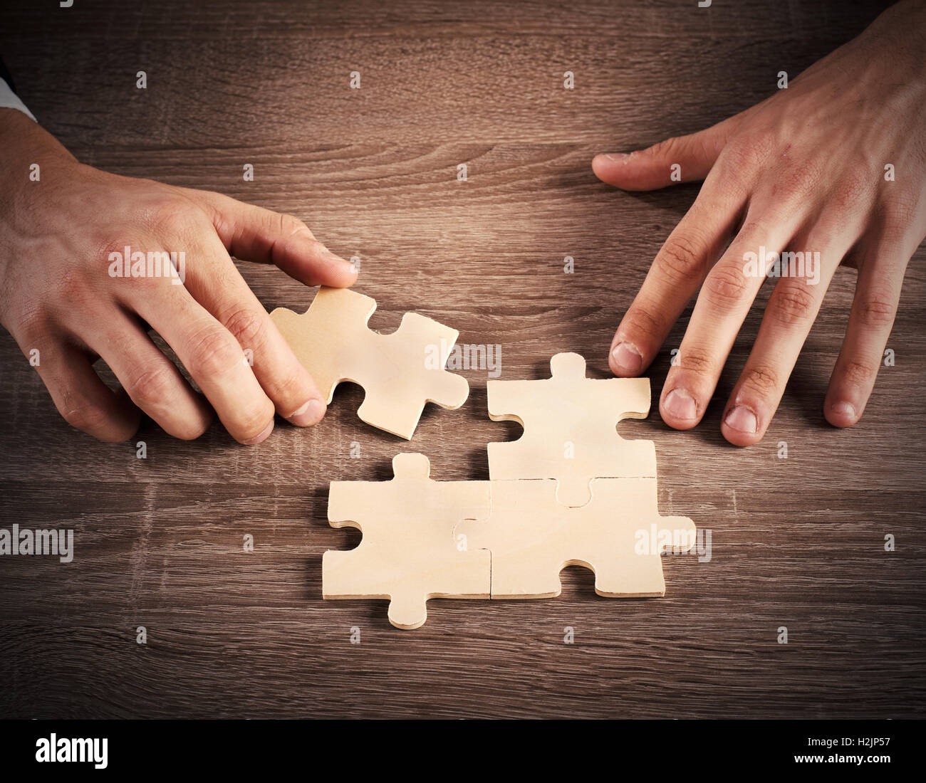 Complete a puzzle Stock Photo