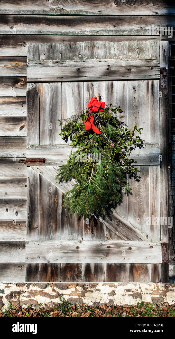 Vintage Christmas vintage door decorations on a weathered barn door