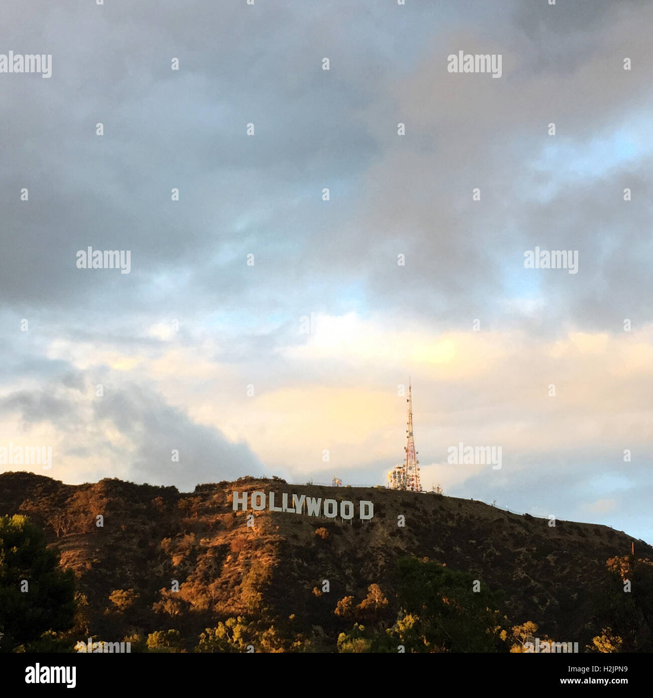 The world famous Hollywood Sign with dramatic sky in hills above Los Angeles, CA Stock Photo
