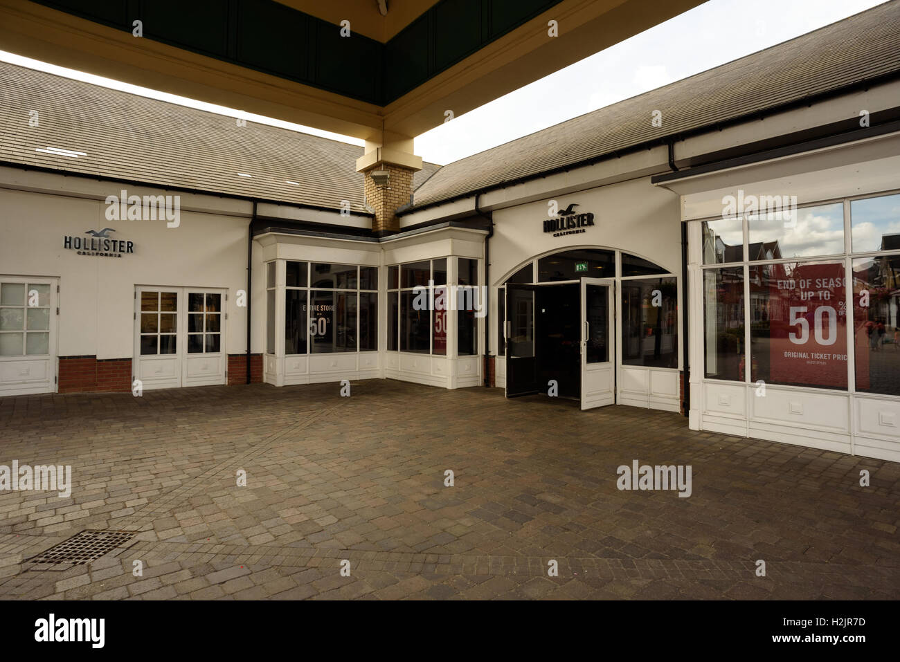 Storefront for Hollister California in the popular shopping resort of Freeport in Braintree Essex Stock Photo
