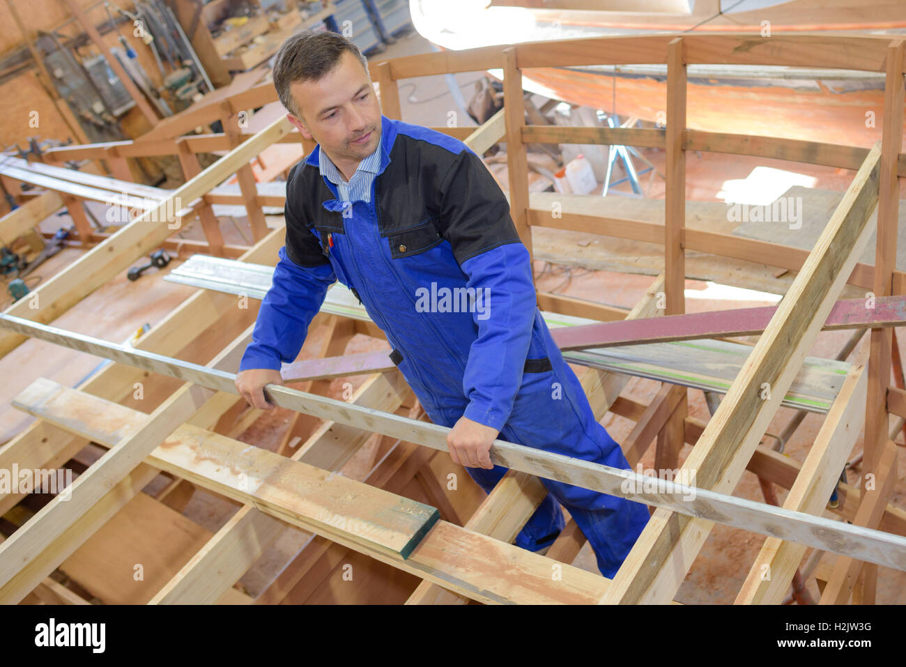 Carpenter building framework of boat Stock Photo