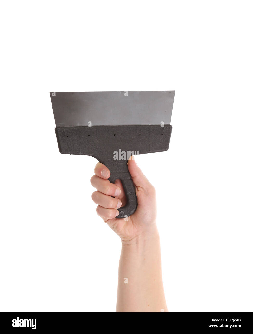 Hand holds metal spatula Stock Photo Alamy