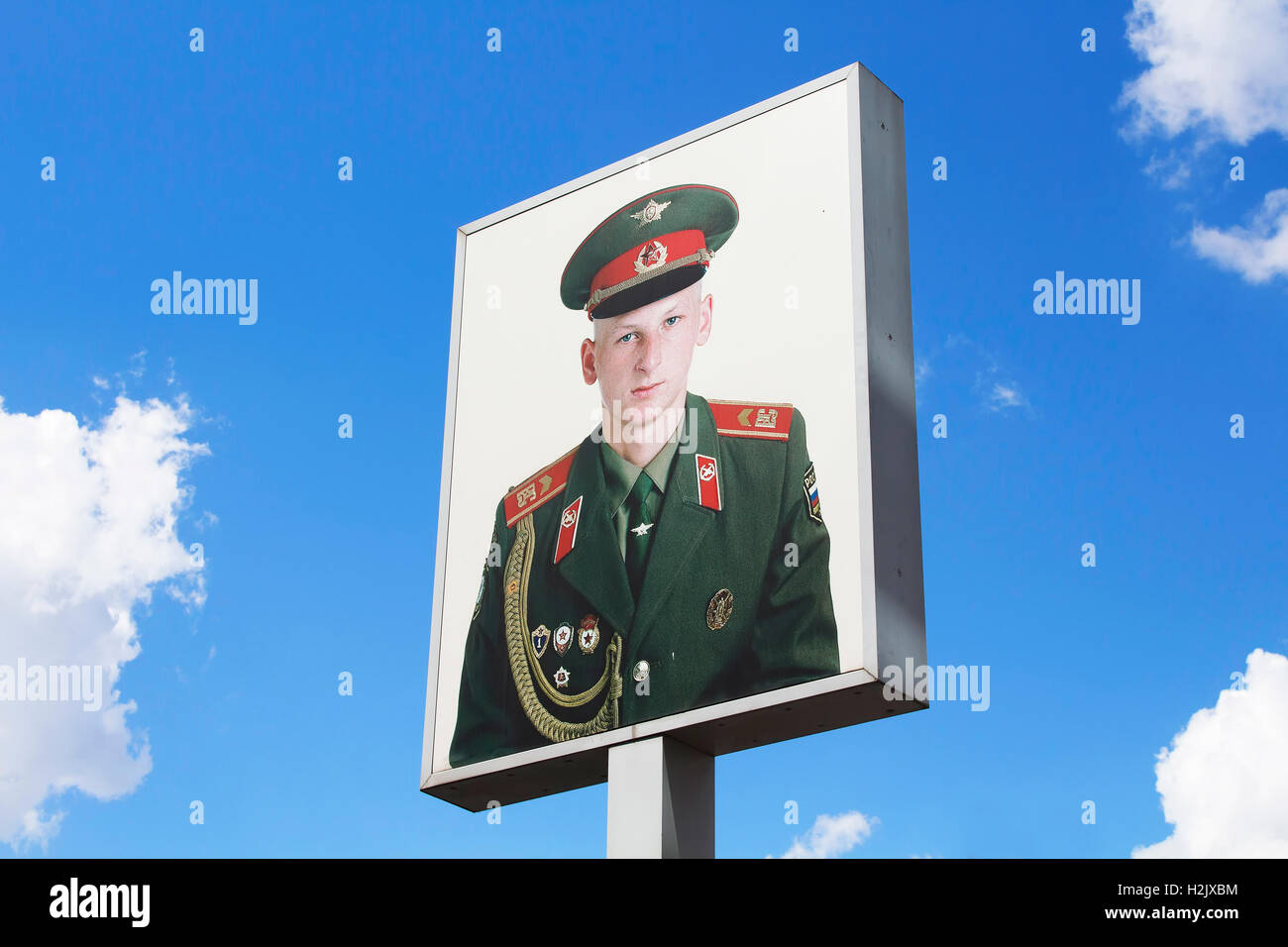 Photograph of soldier placed on sign at Checkpoint Charlie (or "Checkpoint C") given name by the Western Allies to the best-know Stock Photo