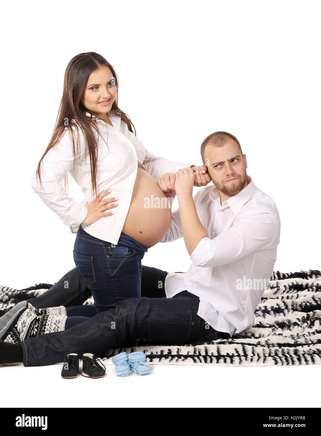 Man and pregnant woman on blanket Stock Photo - Alamy