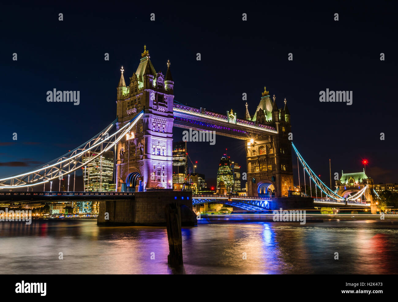 Lights, boats and stars captured in a long exposure of Tower Bridge, London, UK Stock Photo