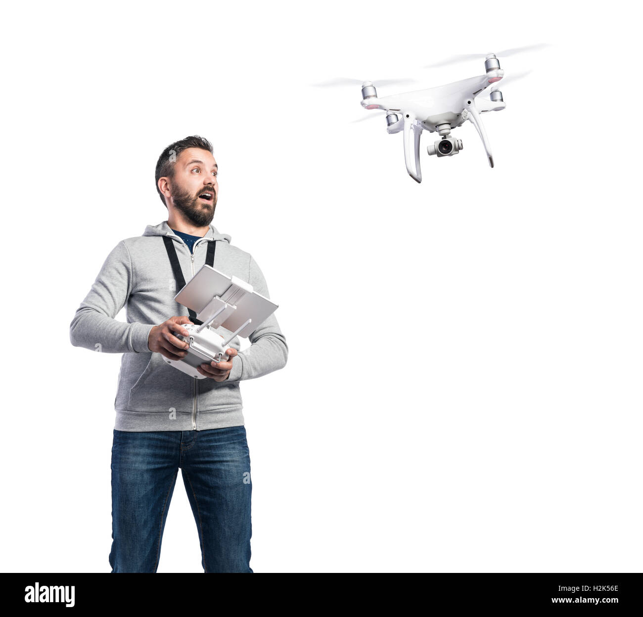 Man with flying drone. Studio shot on white background, isolated Stock  Photo - Alamy