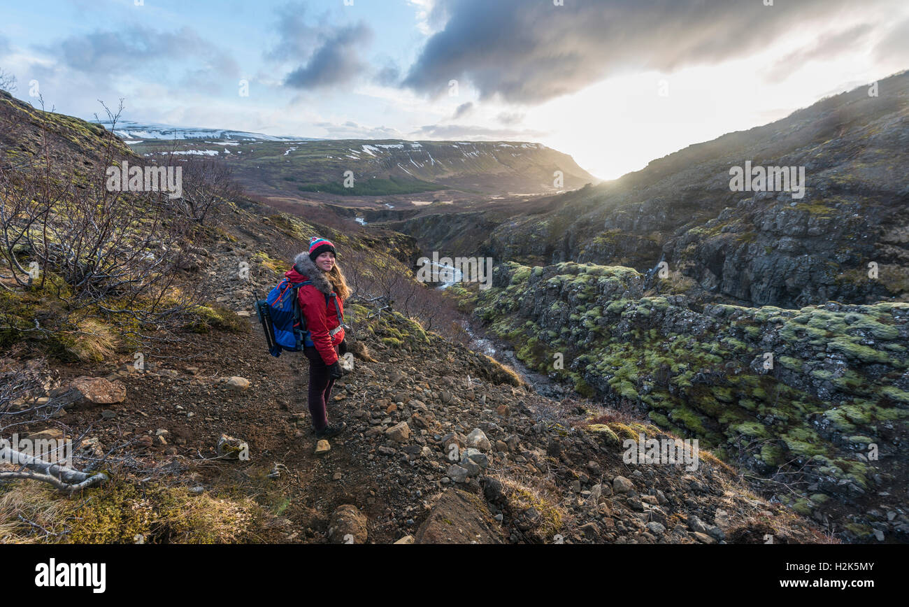 Young woman on hiking trail, Canyon of Glymur, Hvalfjarðarsveit, Western Region, Iceland Stock Photo
