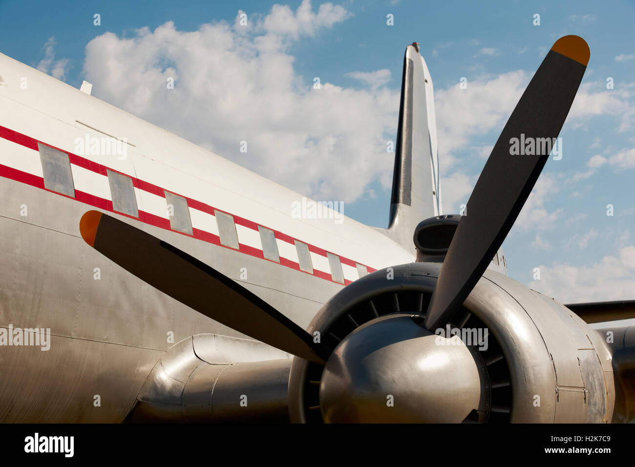 Old aircraft propeller and airframe with blue sky background ...