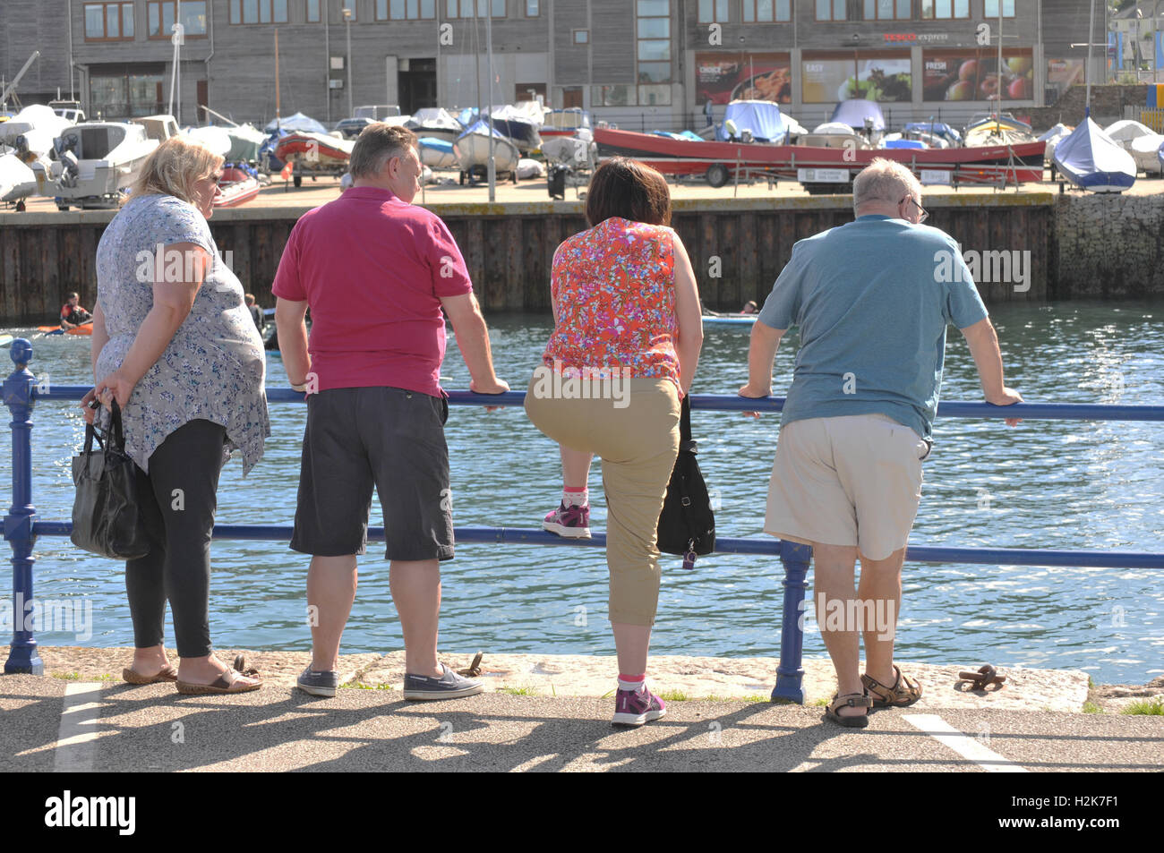 Four people in Falmouth, Cornwall Stock Photo