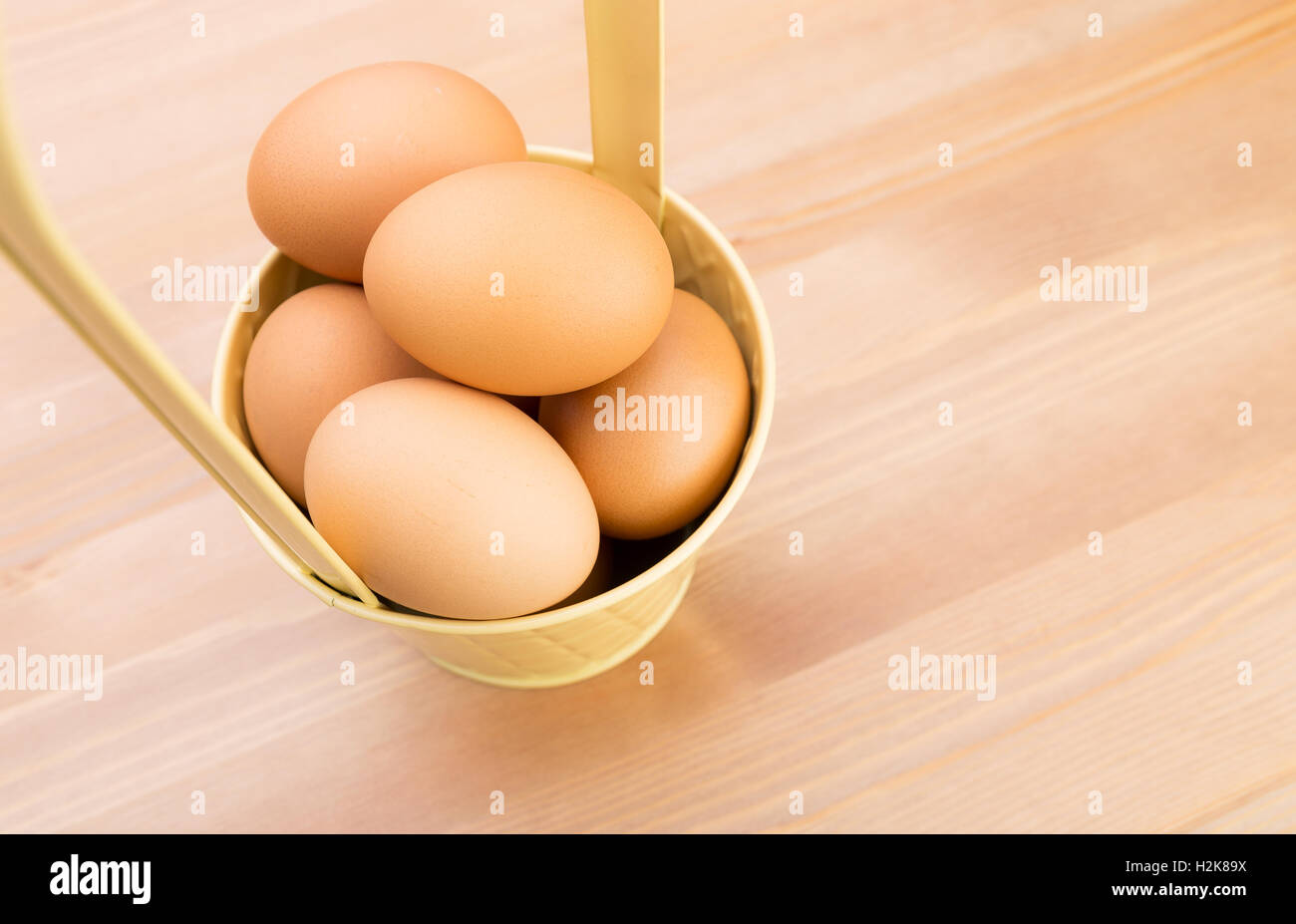 Egg in bucket Stock Photo