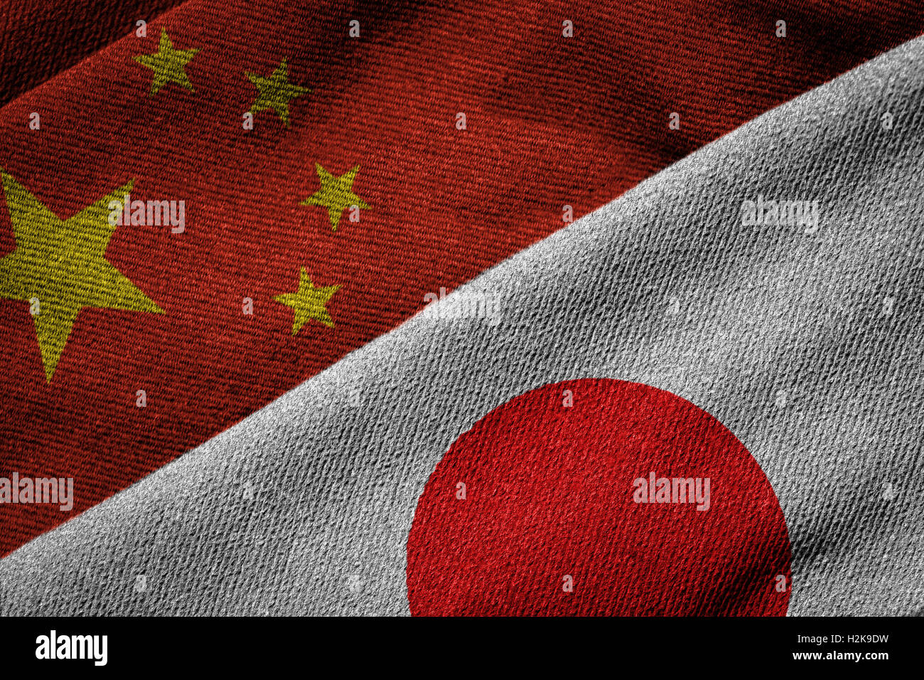 3D rendering of the flags of China and Japan on woven fabric texture