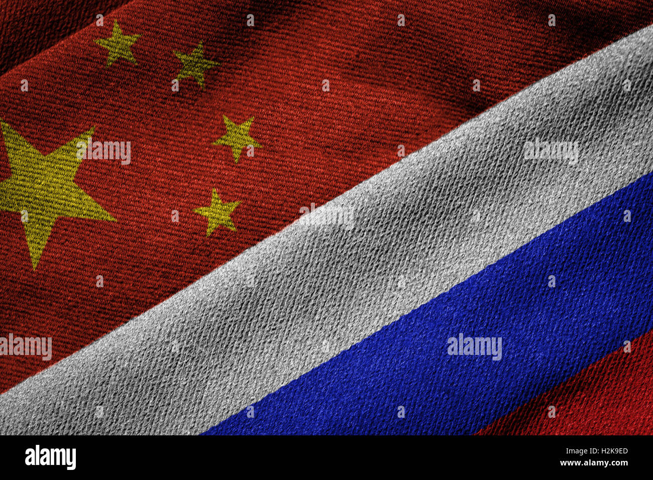 3D rendering of the flags of China and Russia on woven fabric texture. Concept of political, economic; cultural; security partne Stock Photo