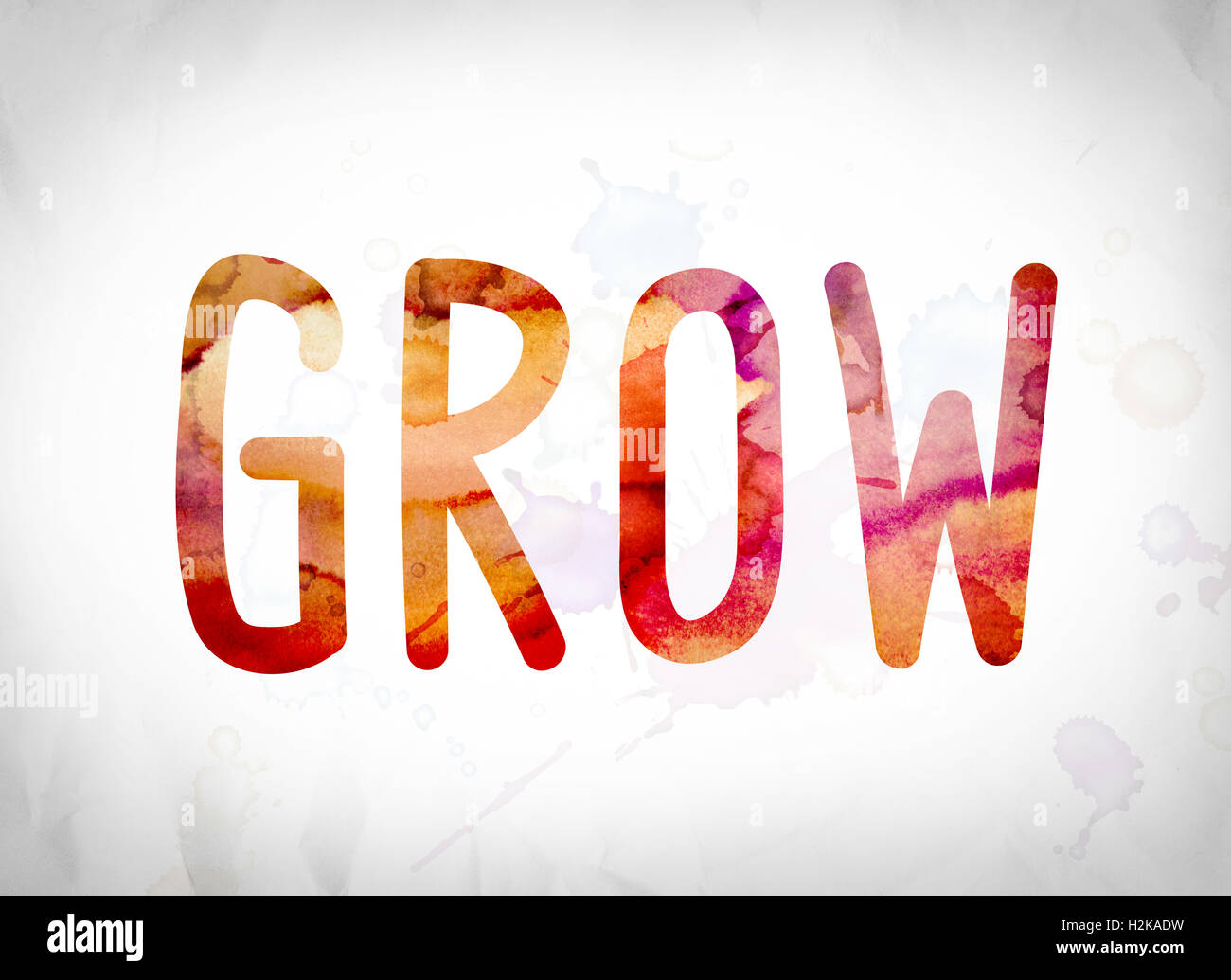 The word "Grow" written in watercolor washes over a white paper