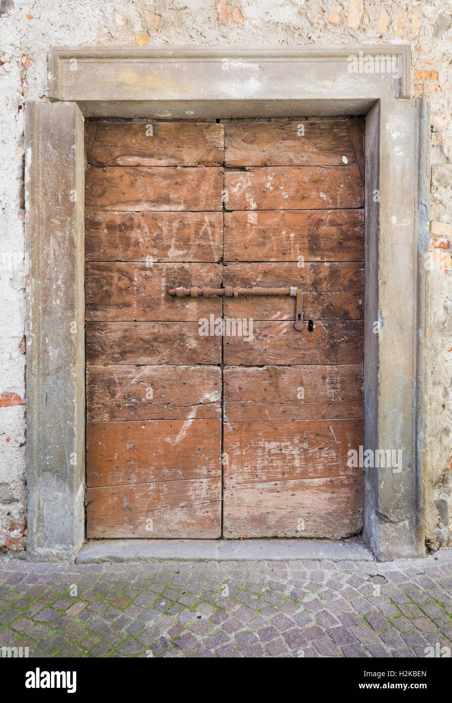 Old closed wooden door with rusty lock Stock Photo - Alamy