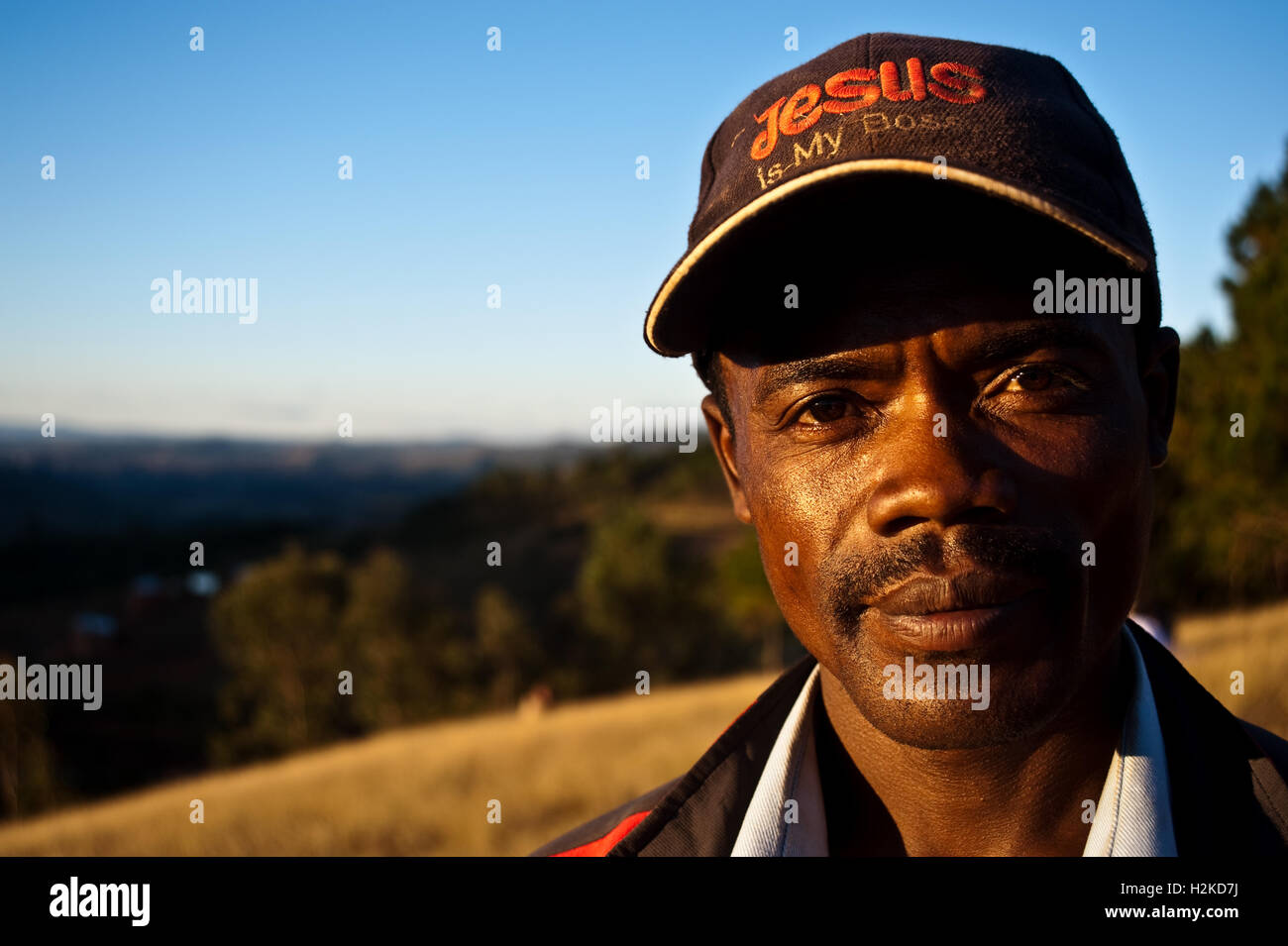 Christian man wearing a cap on which is written 'Jesus is my boss' ( Madagascar). He belongs to the betsileo ethnic group. Stock Photo