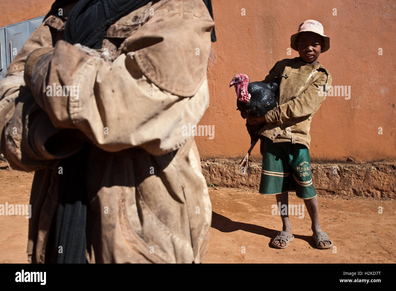 Betsileo boy holding a turkey ( Madagascar) Stock Photo