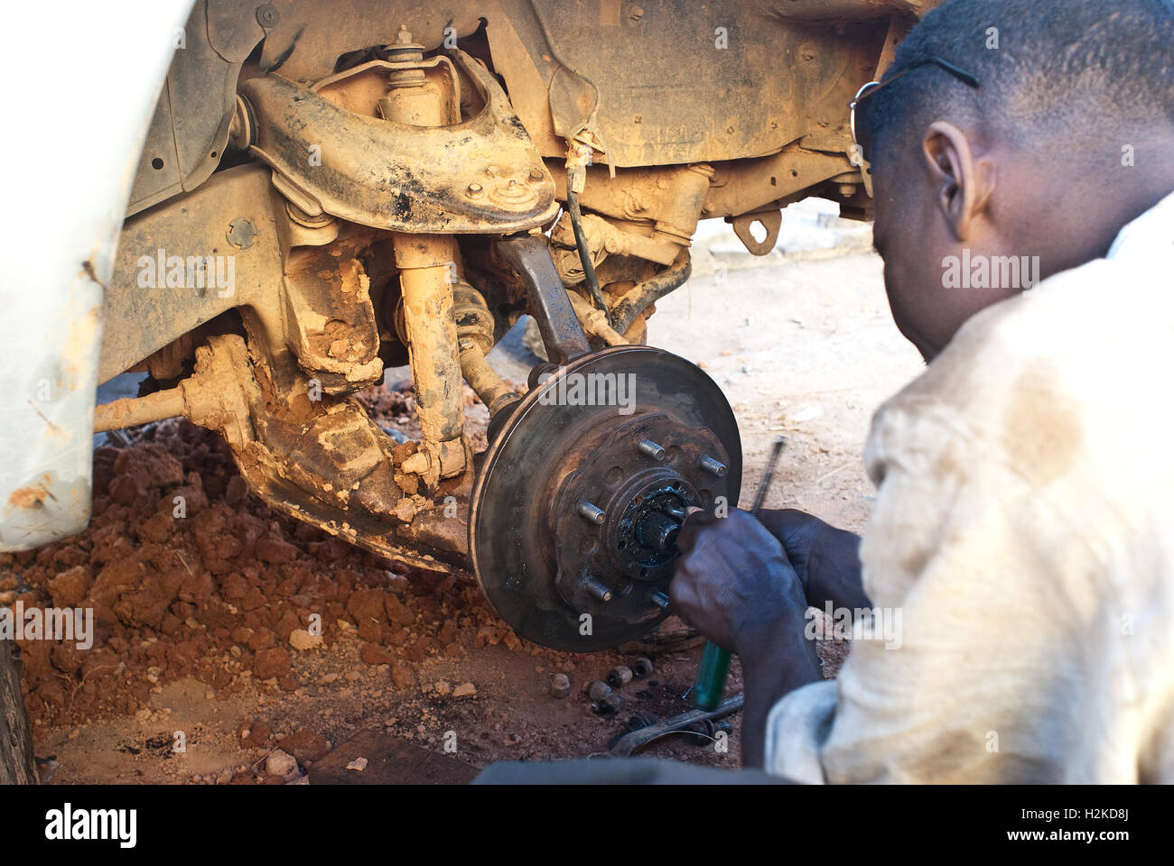 Man repairing a car ( Madagascar) Stock Photo