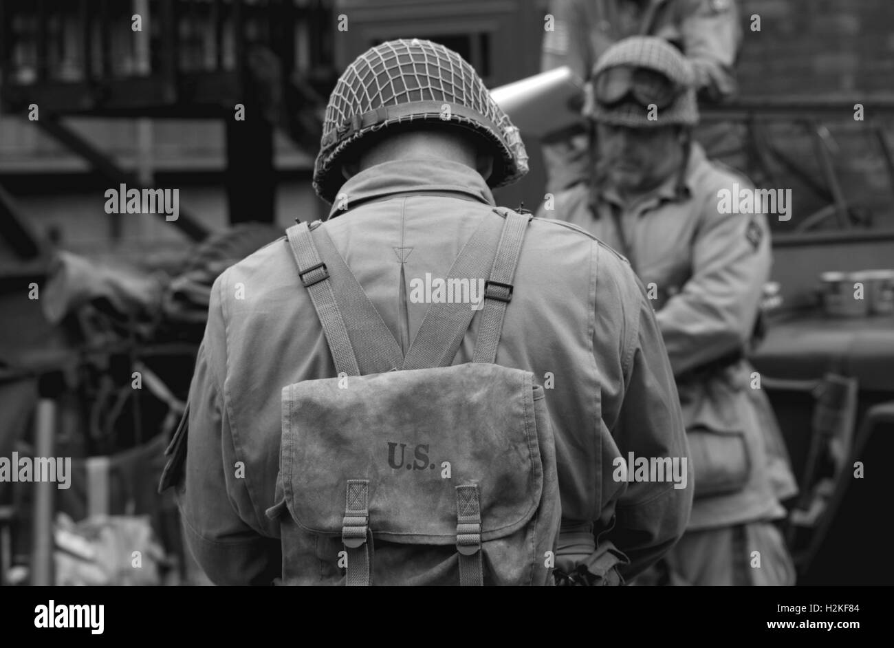 black and white soilders in us uniform heads tilted Stock Photo