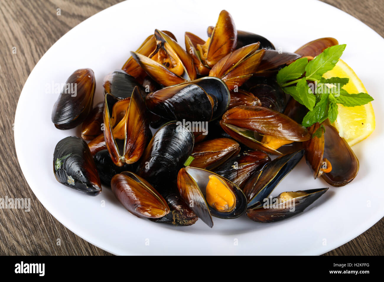 Boiled mussels with parsley on the wood background Stock Photo Alamy