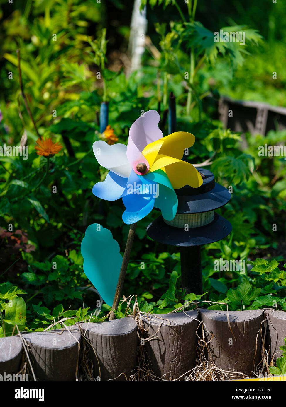 Windy revolving object in a garden Stock Photo